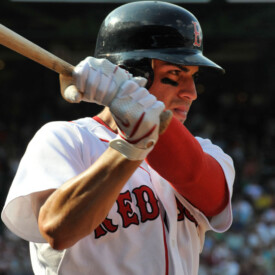 Red Sox player up at bat, ready to swing